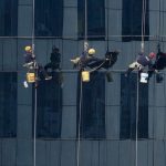 window-cleaner-window-cleaning-office-person-first-mayo